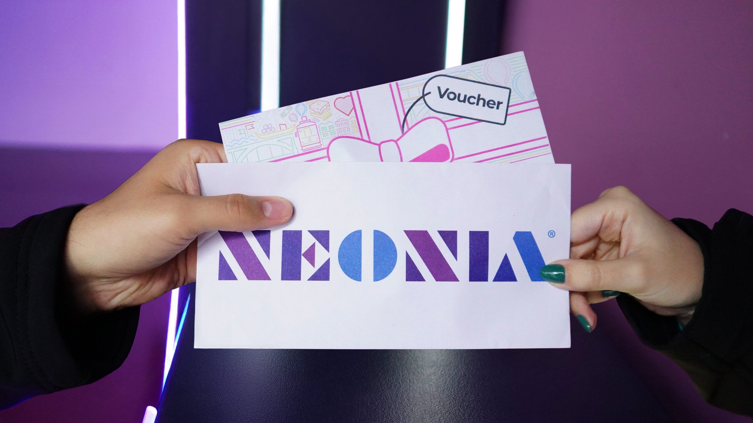 Two people exchanging a Neonia voucher, with the logo visible, in a space lit by colourful lights inside the museum.